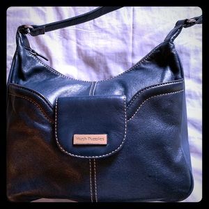 Woman’s blue bag